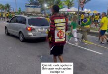 Cena chocante em ato de Flávio: bolsonarista segura homem negro por uma corrente